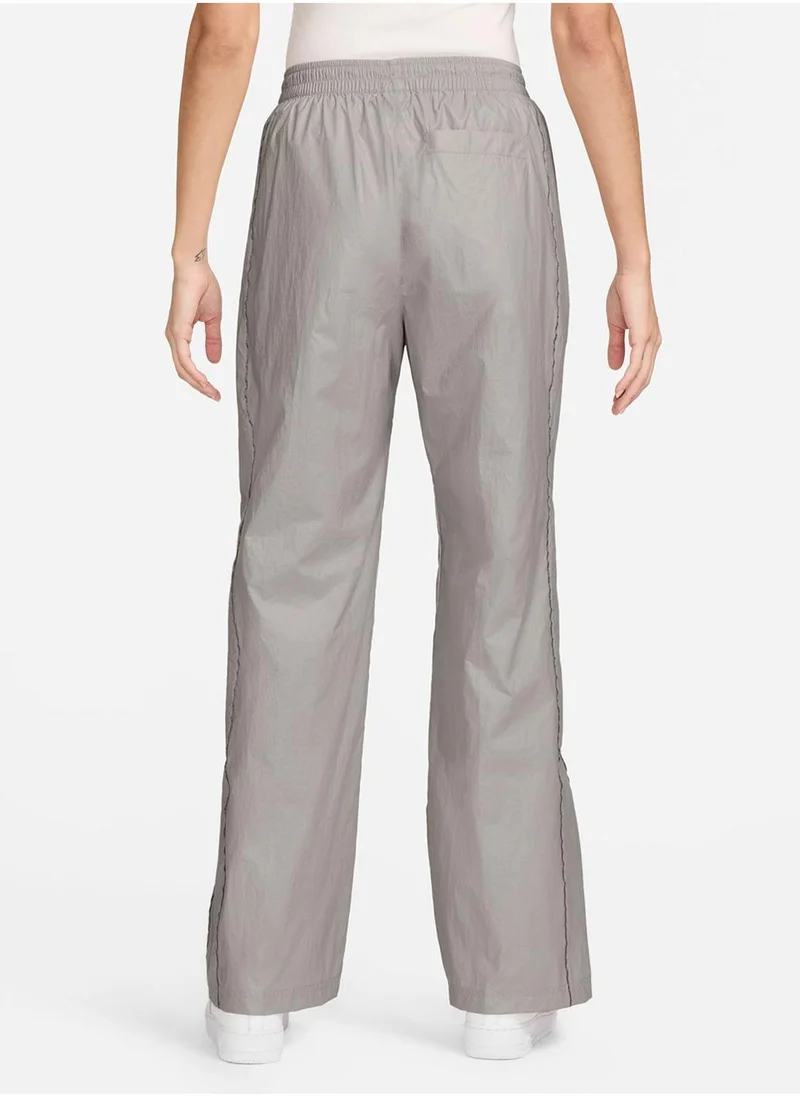 نايكي Women's Woven High-Waisted Open-Hem Trousers