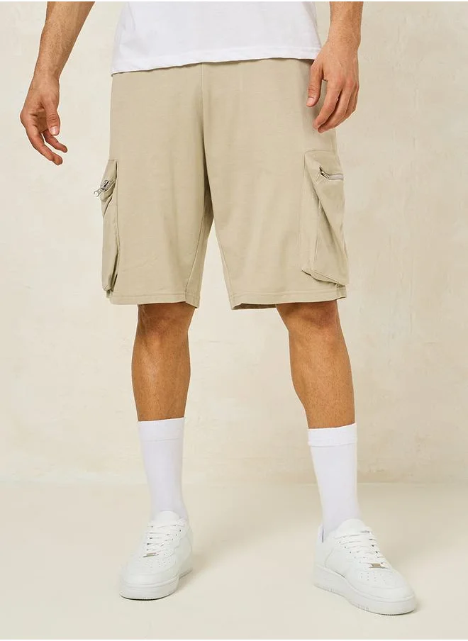 Styli Solid Oversized Shorts with Cargo Pocket Detail