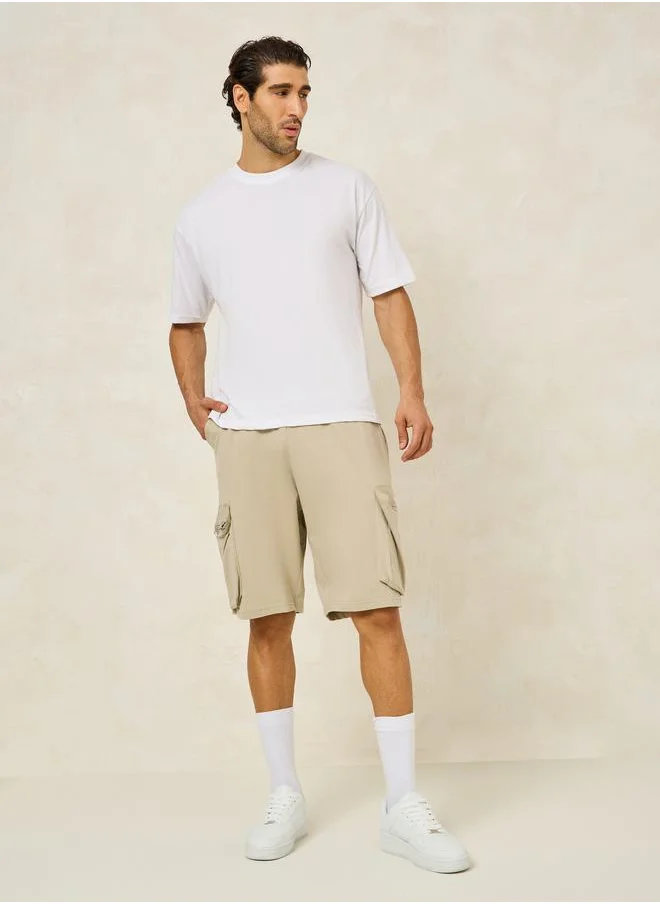 Styli Solid Oversized Shorts with Cargo Pocket Detail