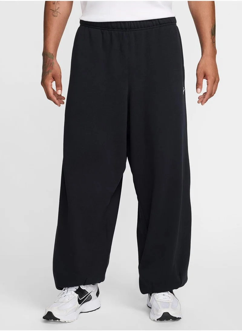 Nike Club Fitted Oversized Sweatpants