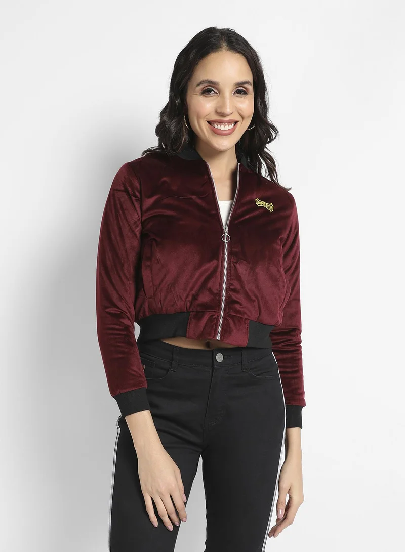 Campus Sutra Women's Maroon Velvet Bomber Jacket With Ribbed Hem For Casual Wear | Low Stand-Up Collar | Long Sleeve | Zipper Closure | Velvet Jacket Crafted With Comfort Fit For Everyday Wear