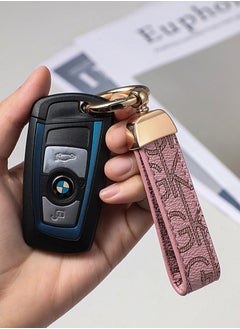 KeyAmor Elegant metal and leather keychain car key holder for adults. Stylish keychain with golden rings, perfect for women, featuring 3 key rings for added functionality. Made with elegant and refined light pink leather, it offers 360-degree rotation for convenience and comes beautifully packaged in a fancy gift box, making it an excellent accessory or gift choice.  - Image 1