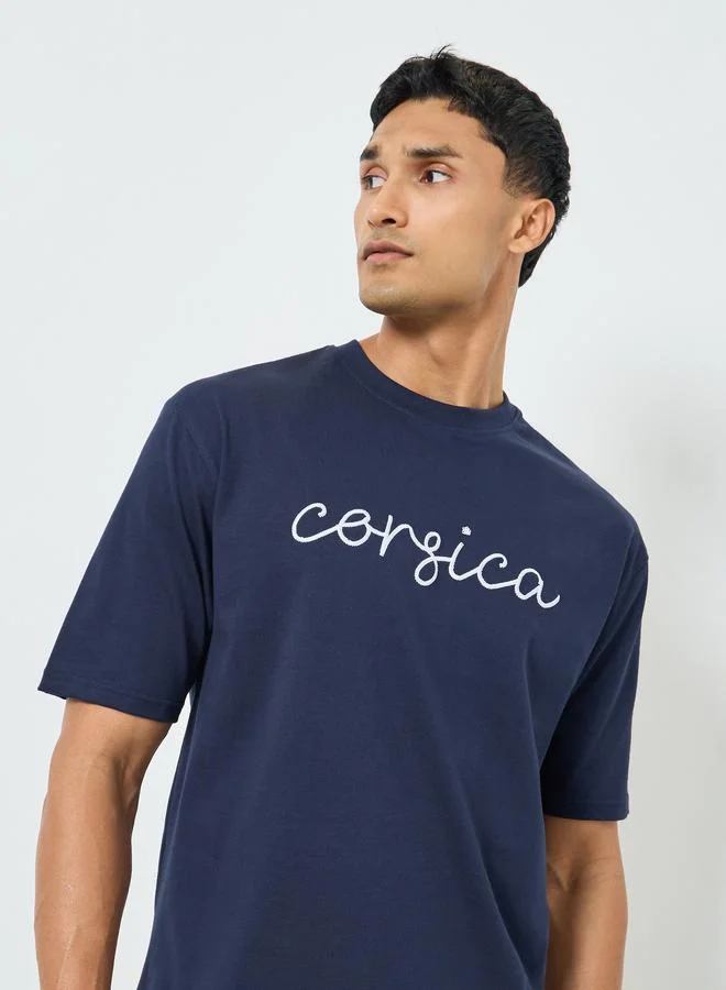 Styli Men Oversized Crew Neck Slogan T-Shirt