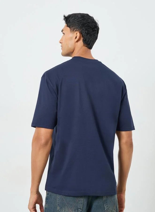 Styli Men Oversized Crew Neck Slogan T-Shirt