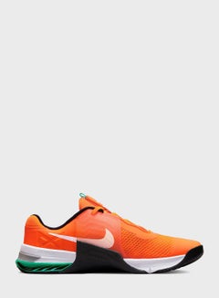 nike training metcon sneakers in white and orange
