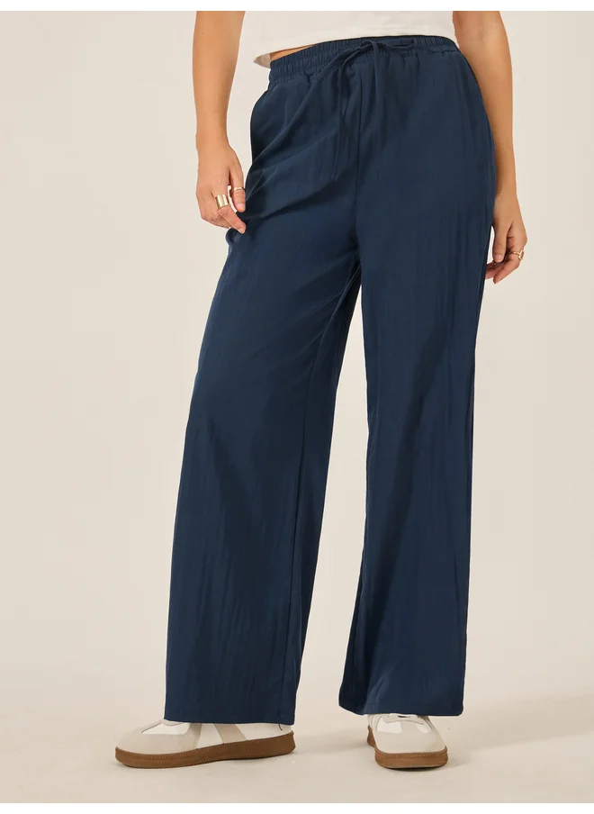 Styli Styli Plain Drawstring Waist Wide Leg Pants