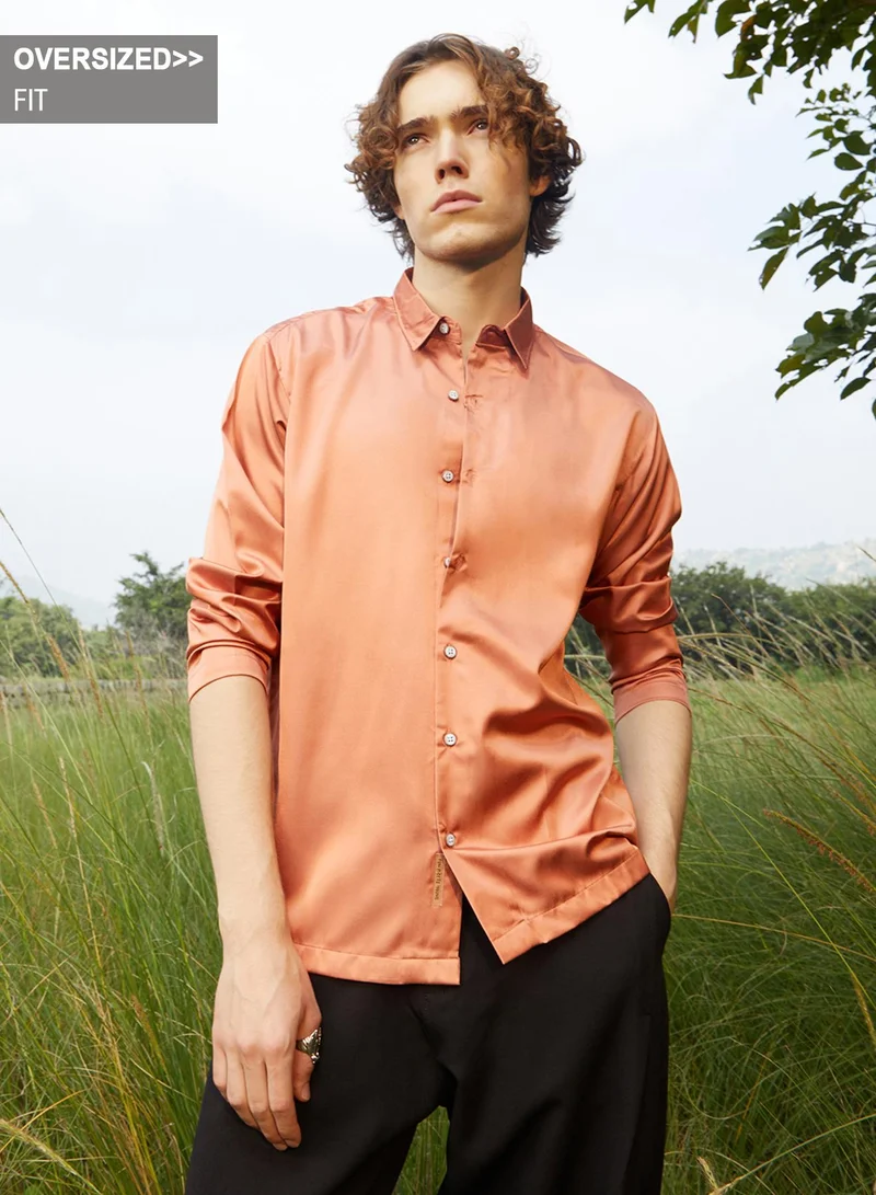 Campus Sutra Campus Sutra Men's Copper Orange Satin Oversized Shirt For Casual Wear | Spread Collar | Long Regular Sleeves | Button Closure | Oversized Shirt Crafted With Comfort Fit For Everyday Wear