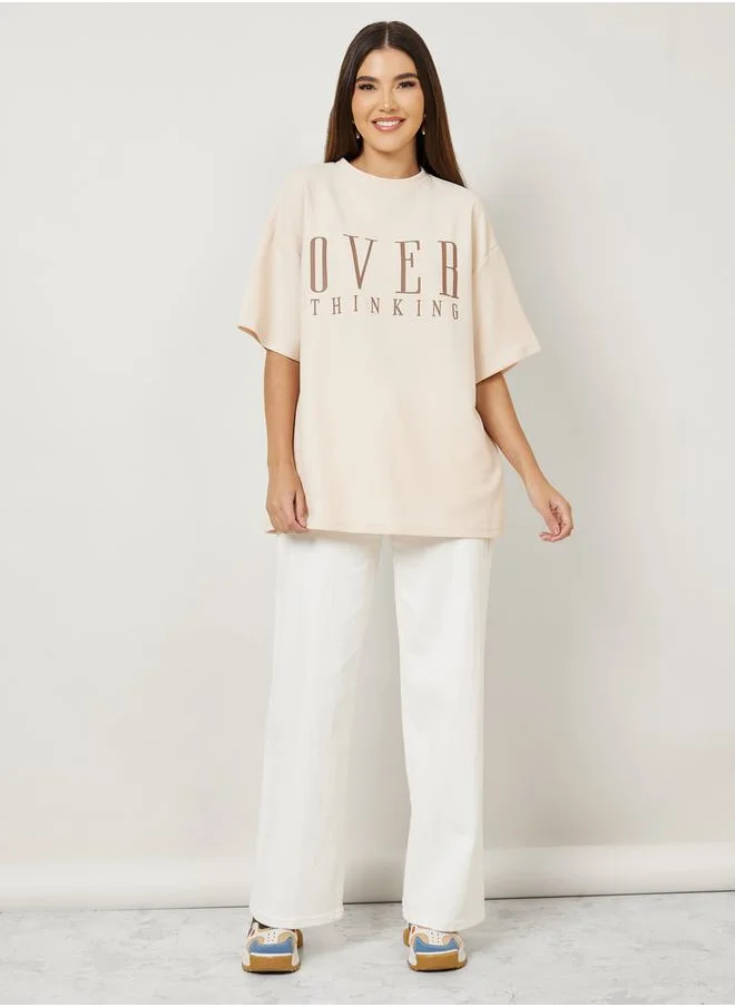 Styli Oversized Textured Contrast Slogan Print Drop Shoulder T-Shirt