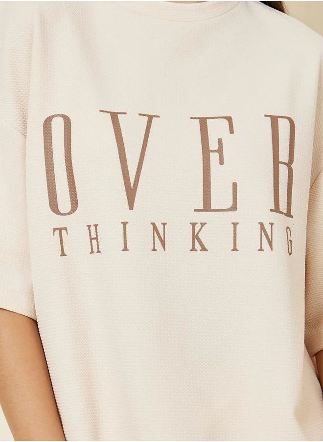 Styli Oversized Textured Contrast Slogan Print Drop Shoulder T-Shirt