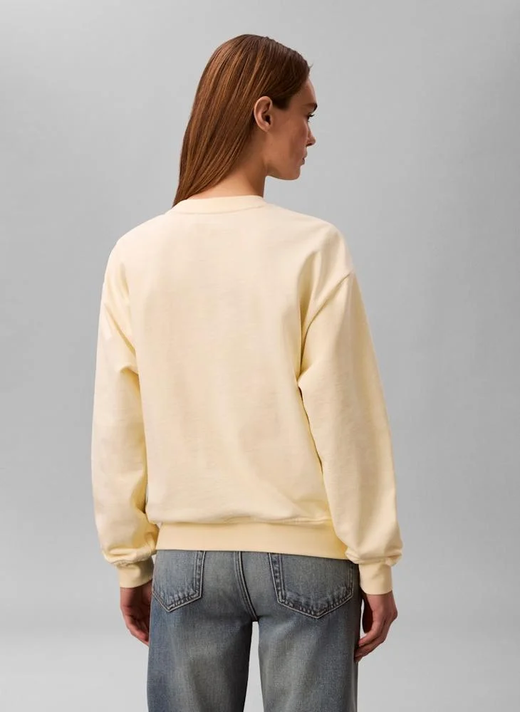 Calvin Klein Jeans  Logo Graphic Crew Neck Sweatshirt for Women | Best Price UAE