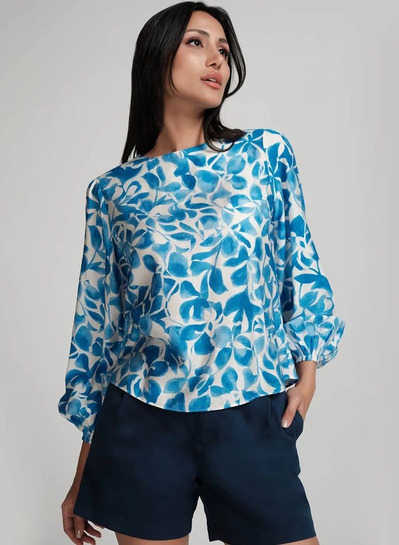 زجزاج توب أزرق مطبوع بأكمام منفوخة