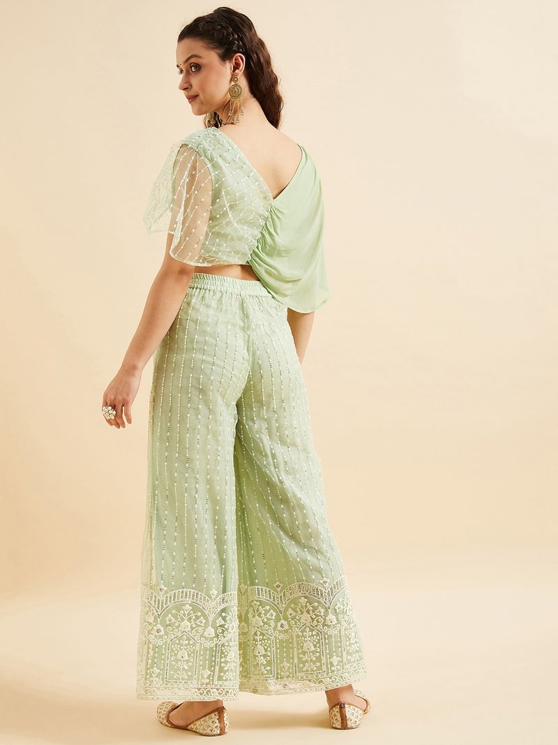بانيت طقم متناسق (Co-ord Set) بلوزة قصيرة مطرَّزة من قماش الشبك (Net) مع بنطلون بالازو - Image 1