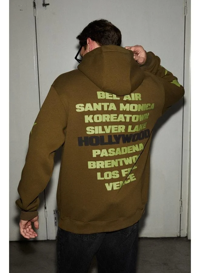 GRIMELANGE TUXON Men's Ultra-Soft Polyester-Lined Sweatshirt with Print Details, Kangaroo Pocket, Regular Khaki.