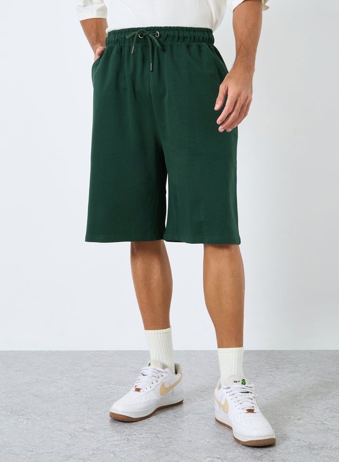 Styli Solid Oversized Shorts with Drawstring - Image 1