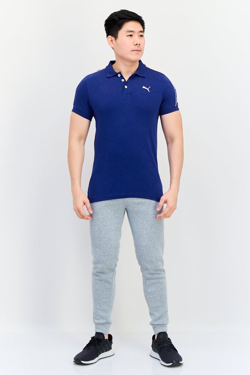 PUMA قميص بولو خارجي للرجال مزين بشعار مطرز، لون كحلي - Image 4