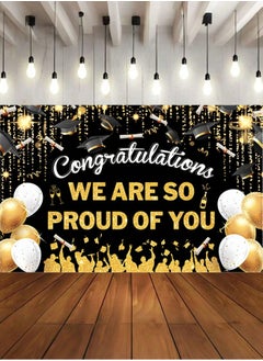 Graduation decoration background in gold and black with the phrase “We are proud of you” and a graduation cap design to add a special touch to your graduation party. Size: (100*150) cm