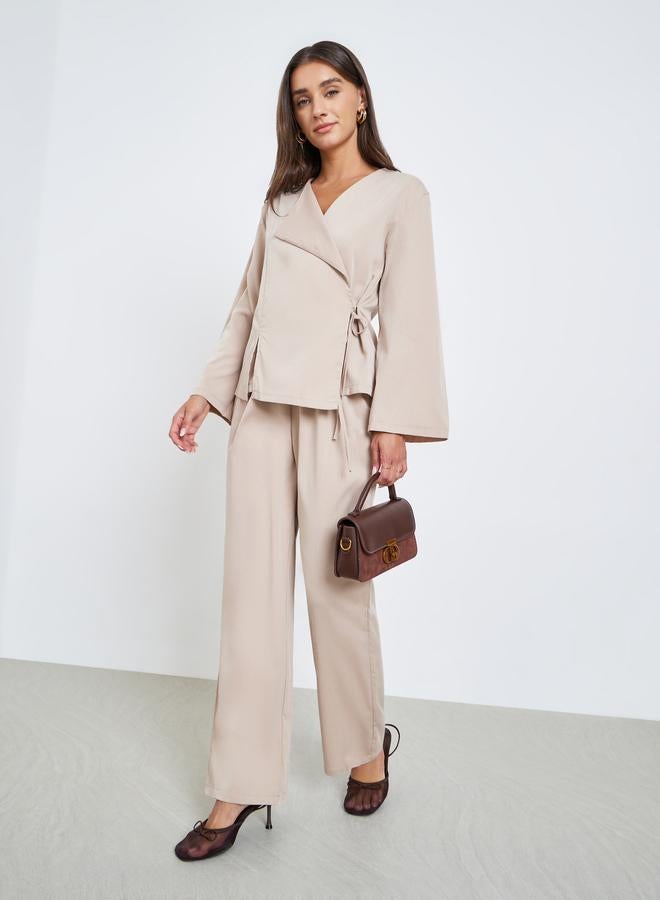 ستايلي طقم منسق من بلوزة لف سادة وبنطال - Image 1