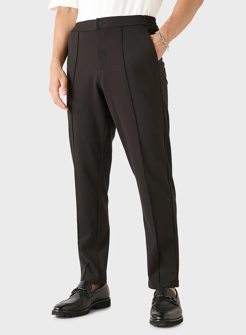ايكونيك Iconic Solid Slim Fit Trousers with Pockets