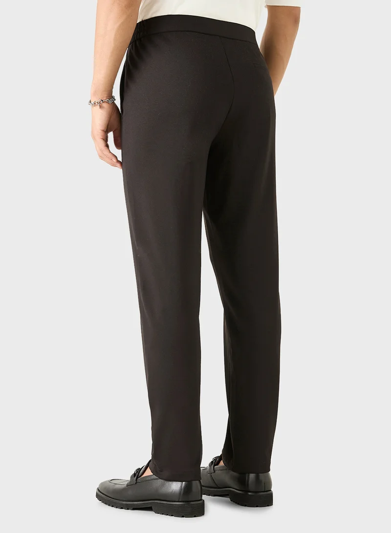 ايكونيك Iconic Solid Slim Fit Trousers with Pockets
