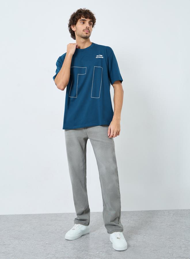 ستايلي تيشيرت واسع بطبعة جرافيك أمامية وخلفية - Image 2