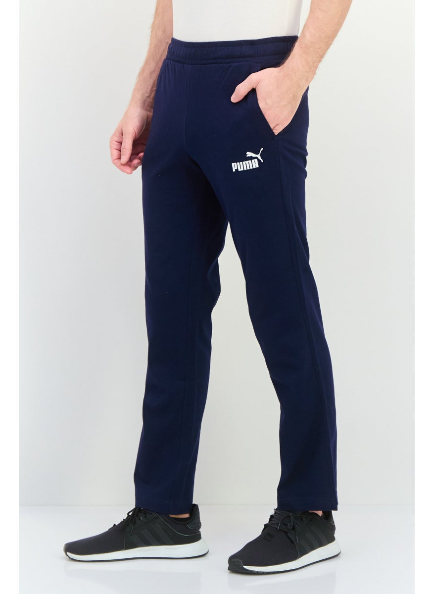 PUMA Men Sportswear Fit Drawstring Outdoor Track Pants, Navy/White  - Image 2