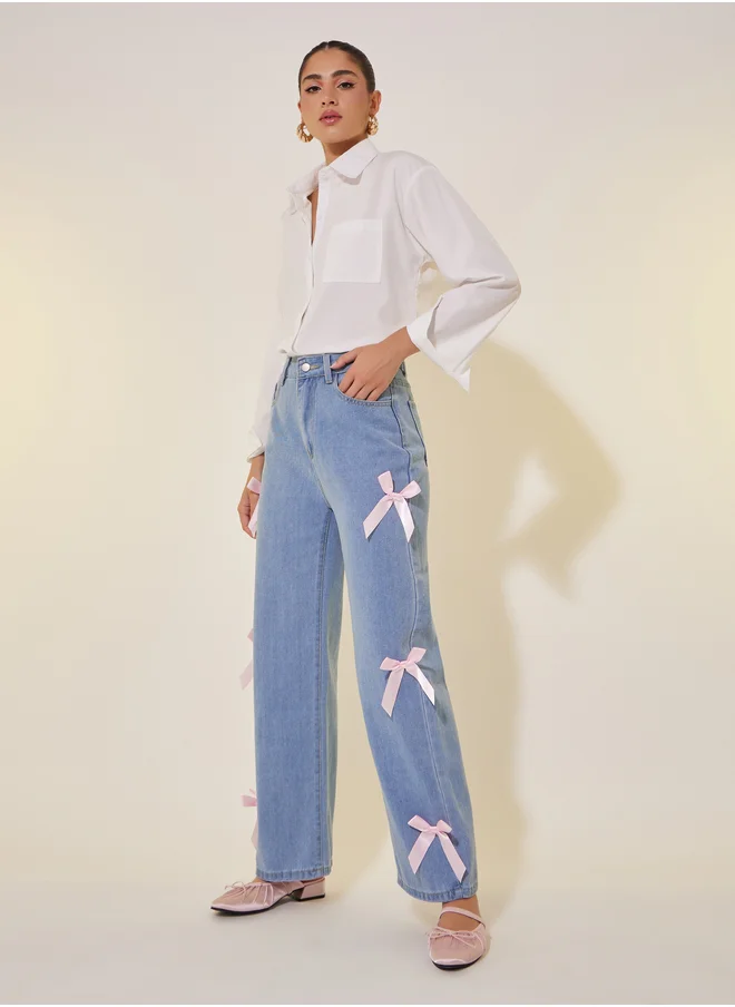 Styli Mid Rise Wide Leg Faded Jeans with Bow Detail