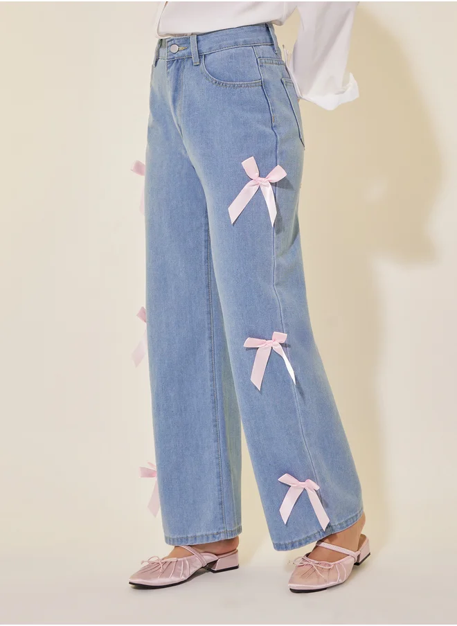 Styli Mid Rise Wide Leg Faded Jeans with Bow Detail