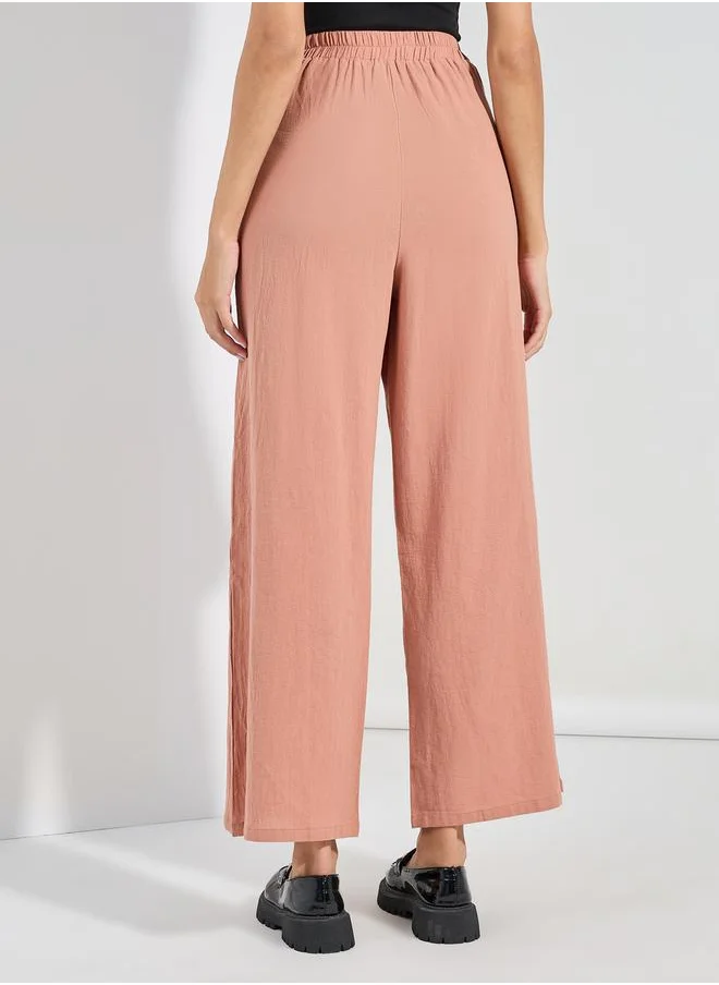 ستايلي Textured Wide Leg Pants with Button Detail