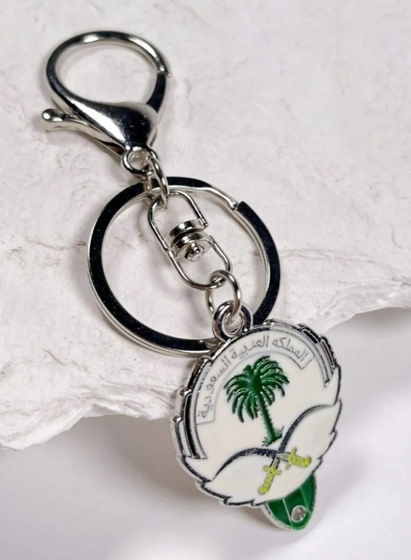 Saudi National Day Decoration Keychain with two swords and palm tree design can be easily hung to decorate bags and car decor to celebrate Saudi National Day - Image 1