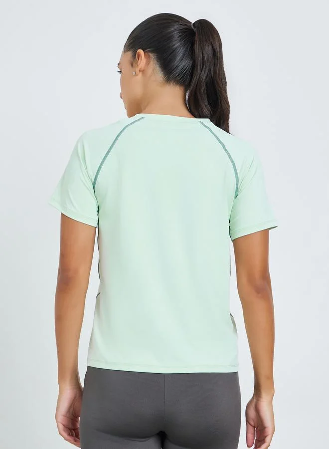 Styli Active  Green Contrast Stitch Detail Short Sleeves Top for Women | Best Price UAE