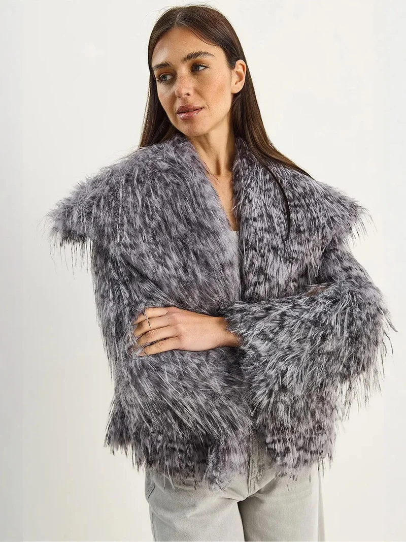 بيانكو لوتشي معطف فرو صناعي بطبعة جلد الفهد كبير الحجم من لوتشي