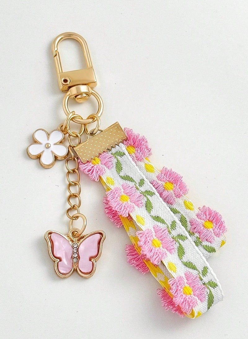 سلسلة مفاتيح بتصميم الدانتيل والزهور مع فراشه باللون الوردي - Image 2