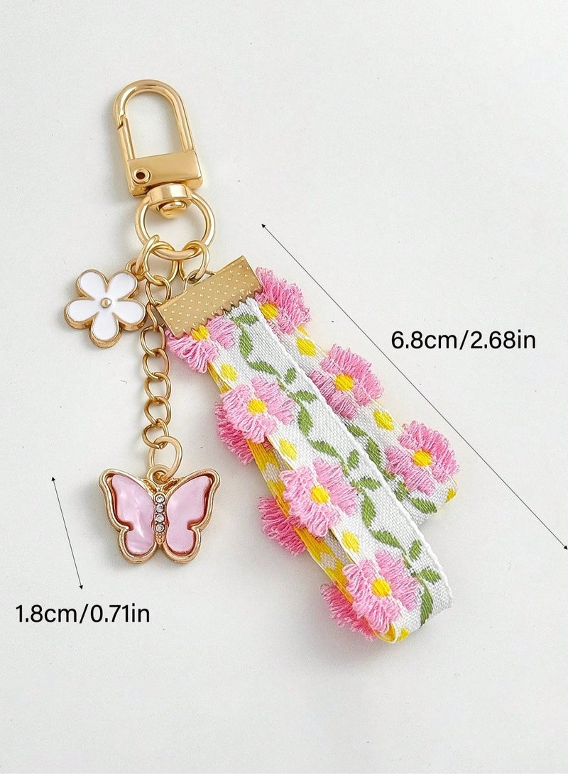 سلسلة مفاتيح بتصميم الدانتيل والزهور مع فراشه باللون الوردي - Image 3