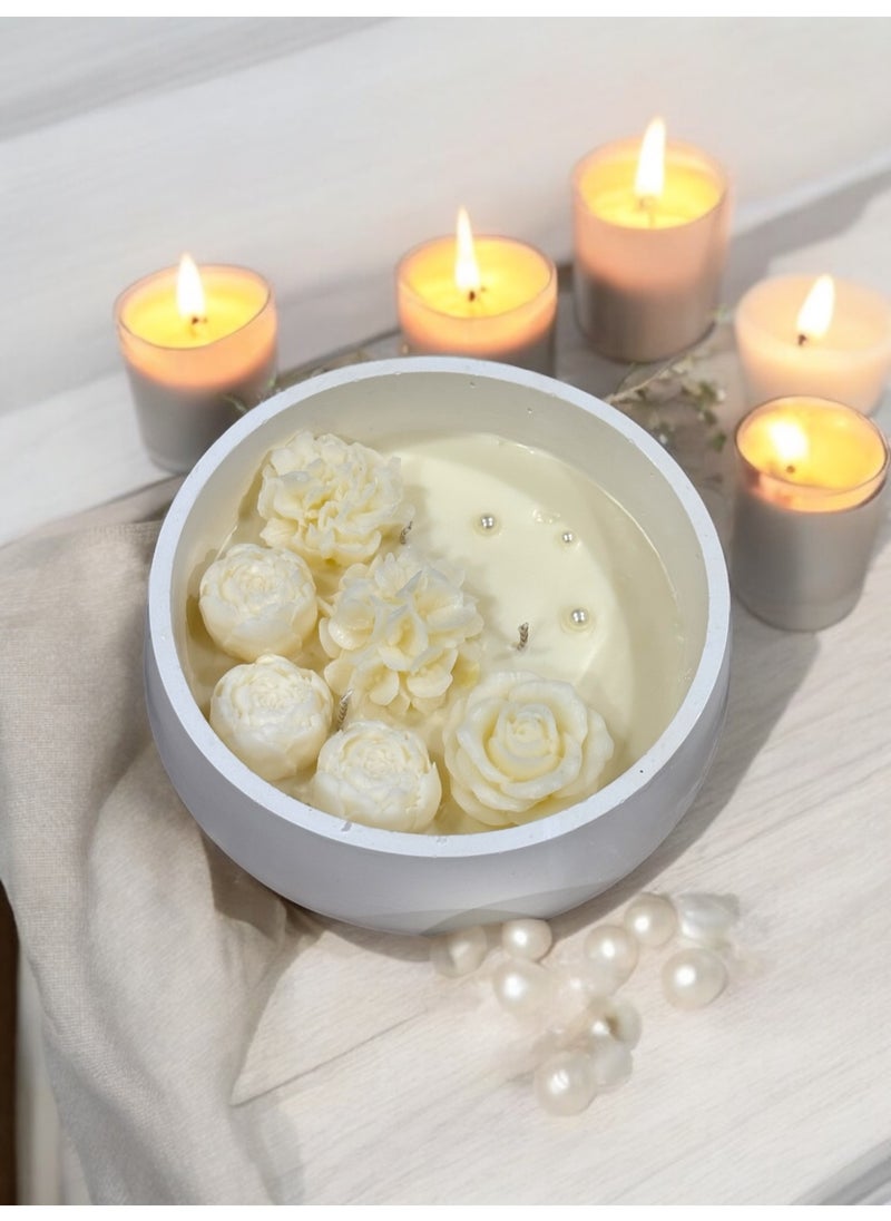 Scented candle with phrases decorated with wax roses in a long circular gypsum plate