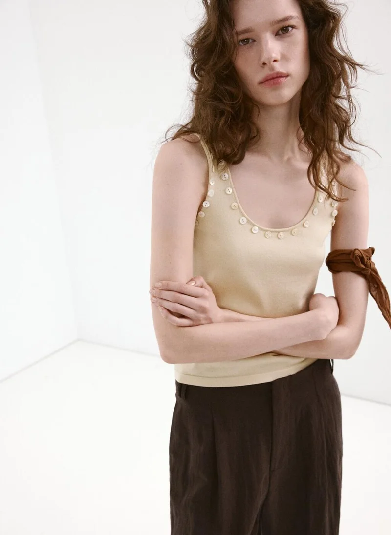 مانجو Sleeveless top with decorative buttons
