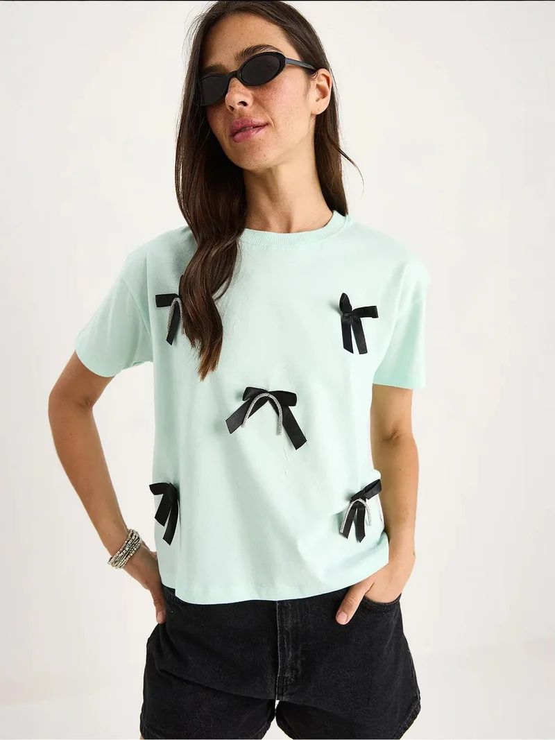 Bianco Lucci Mint Green LUCCI Patterned Crop T-Shirt with Accessory Detail for Women | Best Price UAE