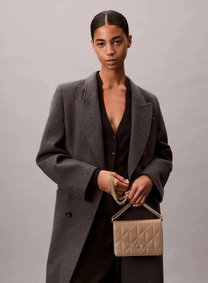 Calvin Klein Desert Taupe Quilted Emblem Logo Mini Bag for Women | Best Price UAE