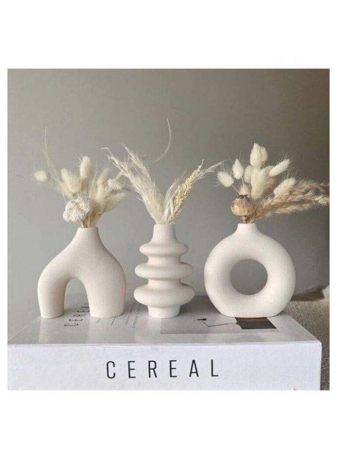 Razz Gallery This elegant 3-piece vase set combines simplicity and sophistication in white. - Image 1
