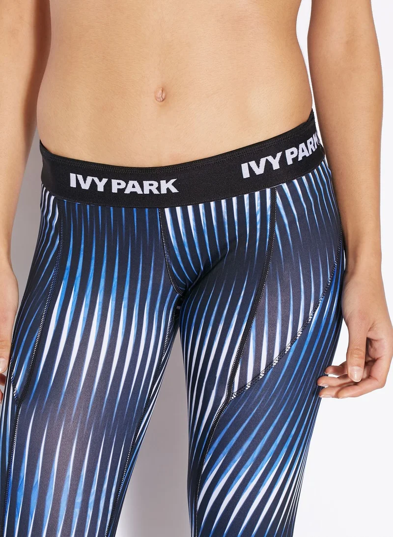 Ivy Park Kaleidostripe Print Mid Rise Ankle Legging