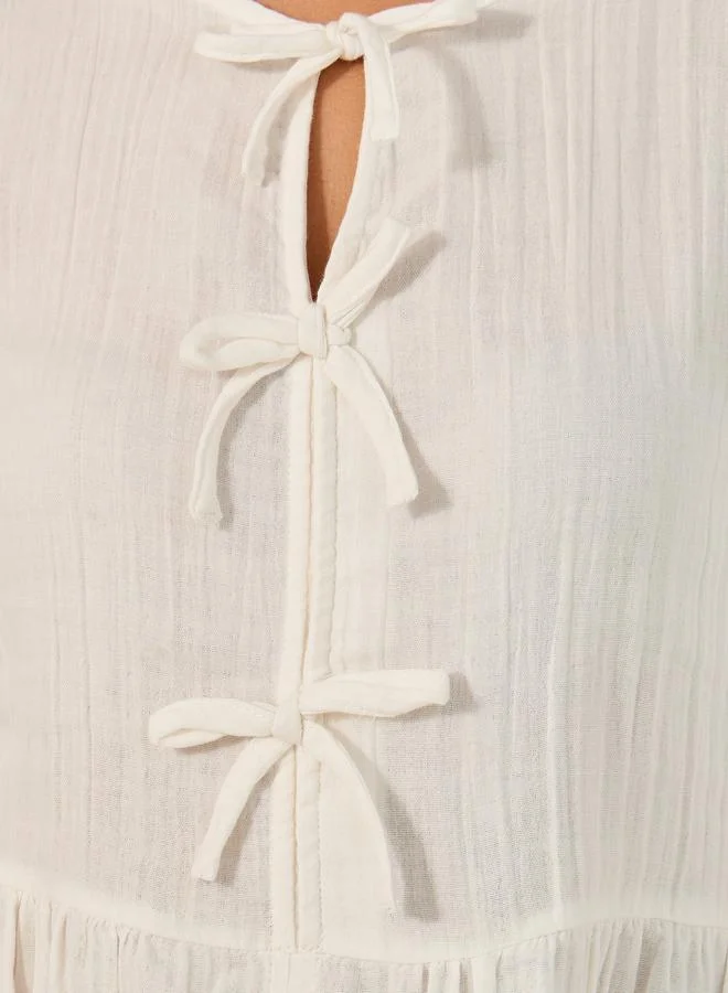Styli Solid Tie-Front Neck Blouse