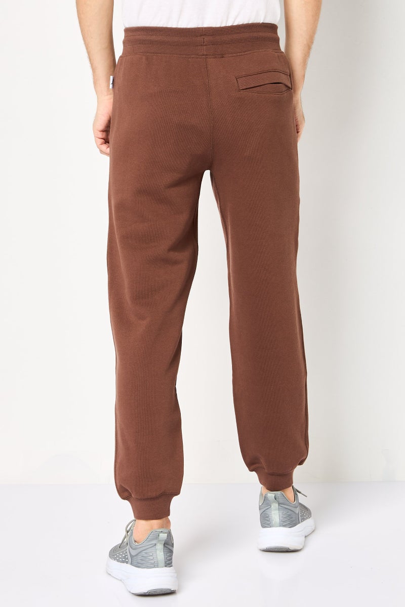 PUMA سروال رياضي للرجال مناسب في الهواء الطلق، بني - Image 4