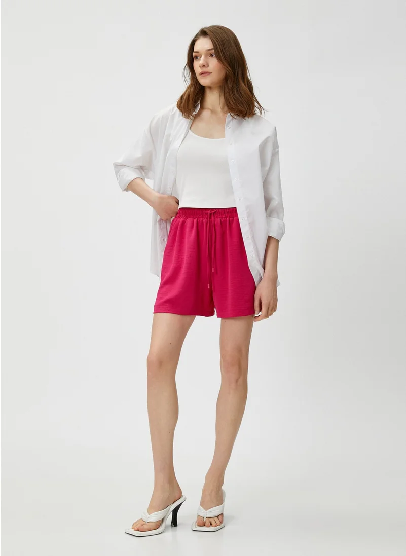 كوتون Cotton Pocket Shorts with Tied Waist