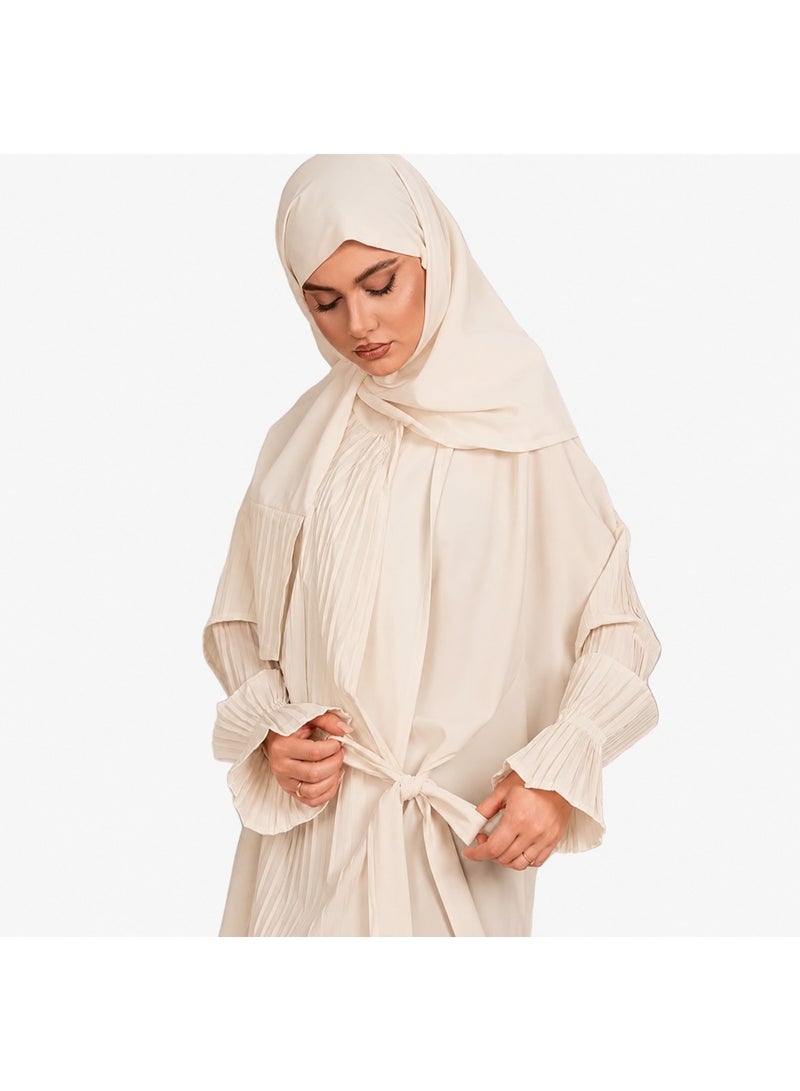Women's prayer garment featuring an open front with a tie closure and a loose, comfortable fit; designed with soft, pleated sleeves and made from lightweight fabric suitable for prayer, Umrah, Hajj, and daily use.