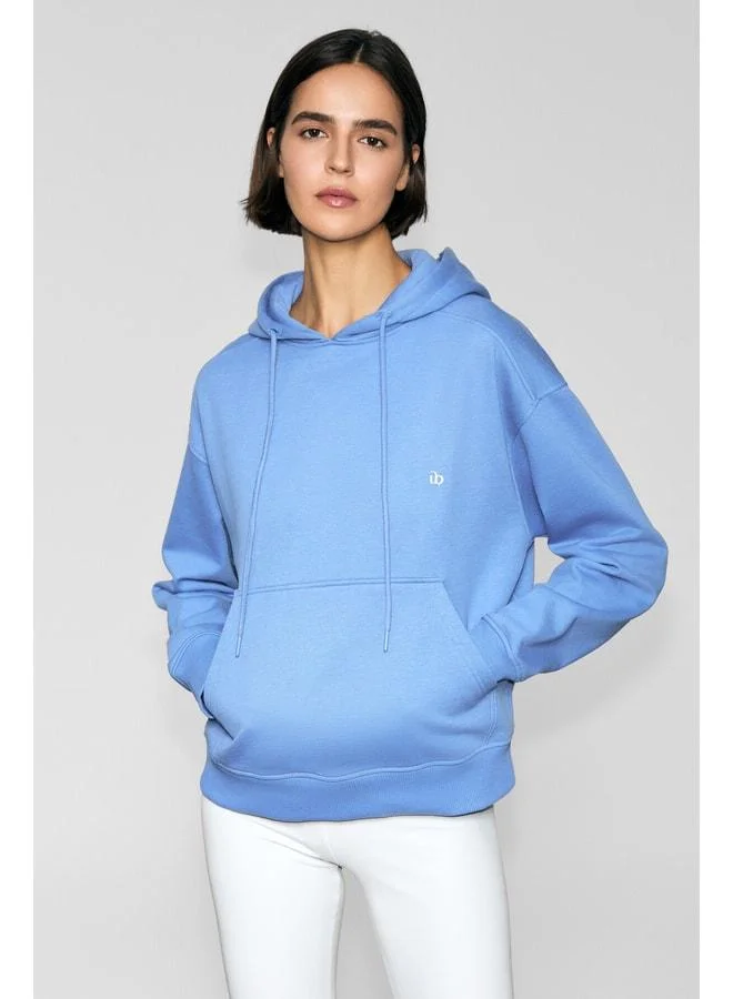 JINGSO Women's Soft Fleece Hooded Sweatshirt with Kangaroo Pocket and Print Details in Blue.