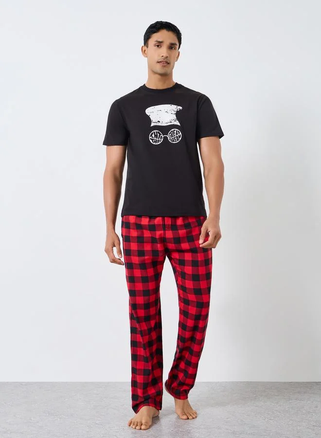 Styli Men Graphic Print Short Sleeve T-Shirt and Checked Pyjama Set