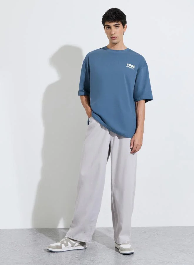 Styli  Oversized Chest & Back Screen Print Cotton Terry Crew Neck T-shirt for Men | Best Price UAE
