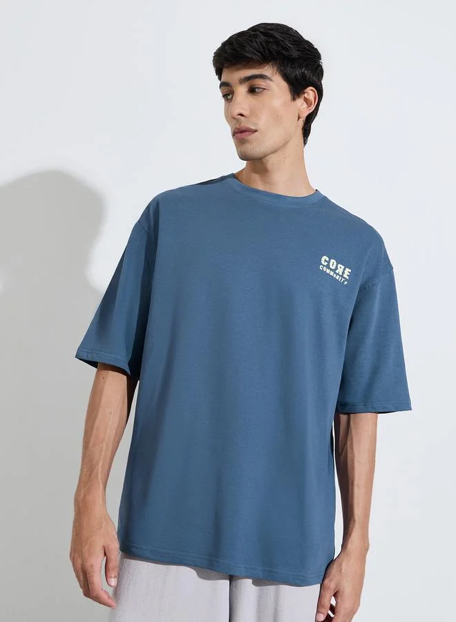 Styli  Oversized Chest & Back Screen Print Cotton Terry Crew Neck T-shirt for Men | Best Price UAE