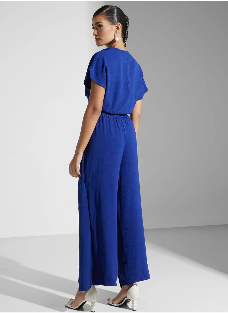 جولدن ابل Surplice Neck Jumpsuit