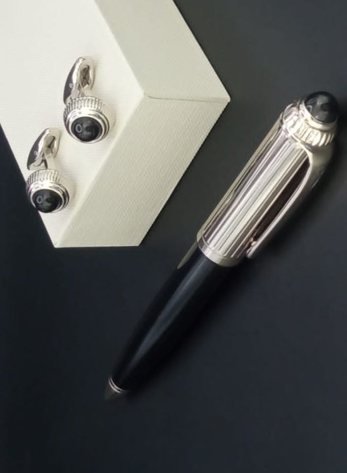 A luxurious and elegant pen and cufflink set with a box