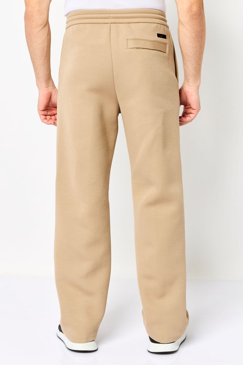 Nike سروال رياضي خارجي فضفاض للرجال، مستقيم الساق، تان - Image 4